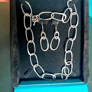 Set of sterling silver flat interlooped oval link necklace and earring set.